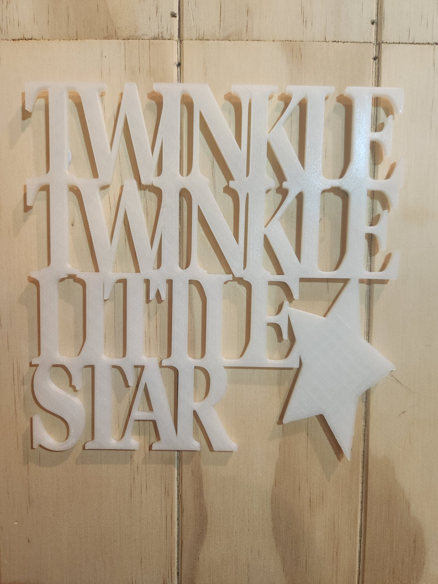 3D printed glow in the dark wall art sign reading Twinkle Twinkle Little Star with star shape, shown in white PLA on a whitewashed wood wall, 190mm x 190mm, handmade in Upper Hutt New Zealand