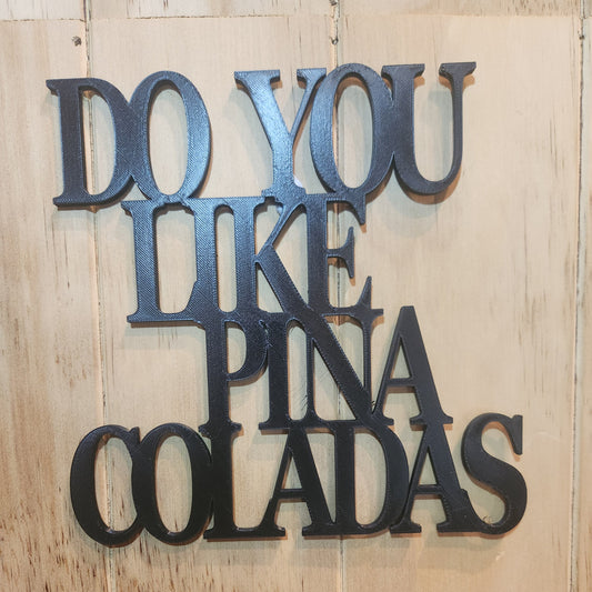 Do You Like Piña Coladas 3D printed wall art sign in tropical green, mounted on wooden wall