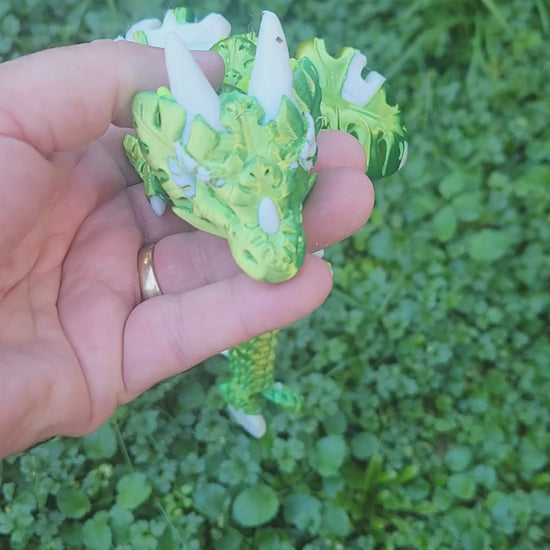 3D printed Monstera Leaf Dragon figure in deep green and white, fully articulated, head close-up showing intricate monstera leaf body texture and white horns, handmade in Upper Hutt NZ by Heidi's 3D Prints