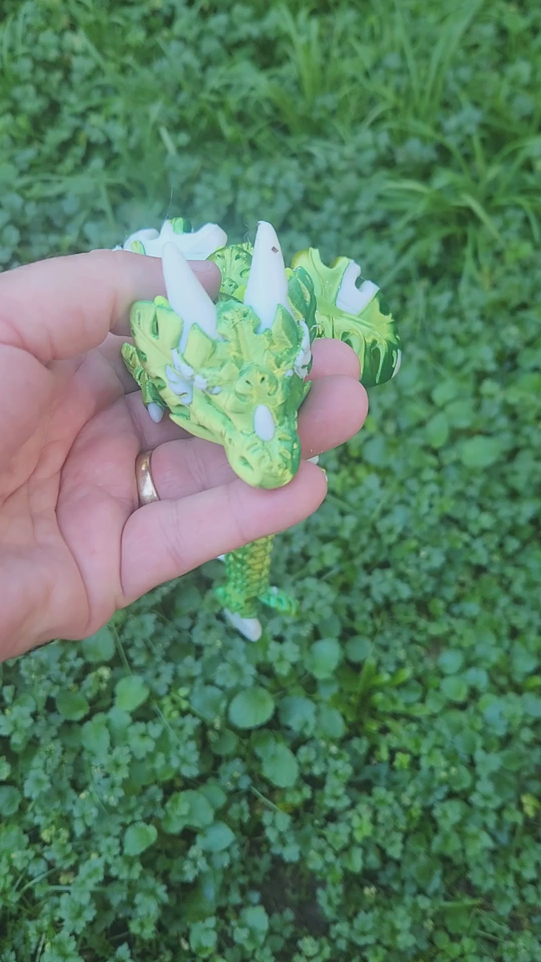 3D printed Monstera Leaf Dragon figure in deep green and white, fully articulated, head close-up showing intricate monstera leaf body texture and white horns, handmade in Upper Hutt NZ by Heidi's 3D Prints
